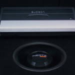 Audison amplifier and Hertz subwoofer in a custom boot fabrication Audison amplifier and Hertz subwoofer in a custom boot fabrication